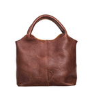 Brown leather handbag on a white background