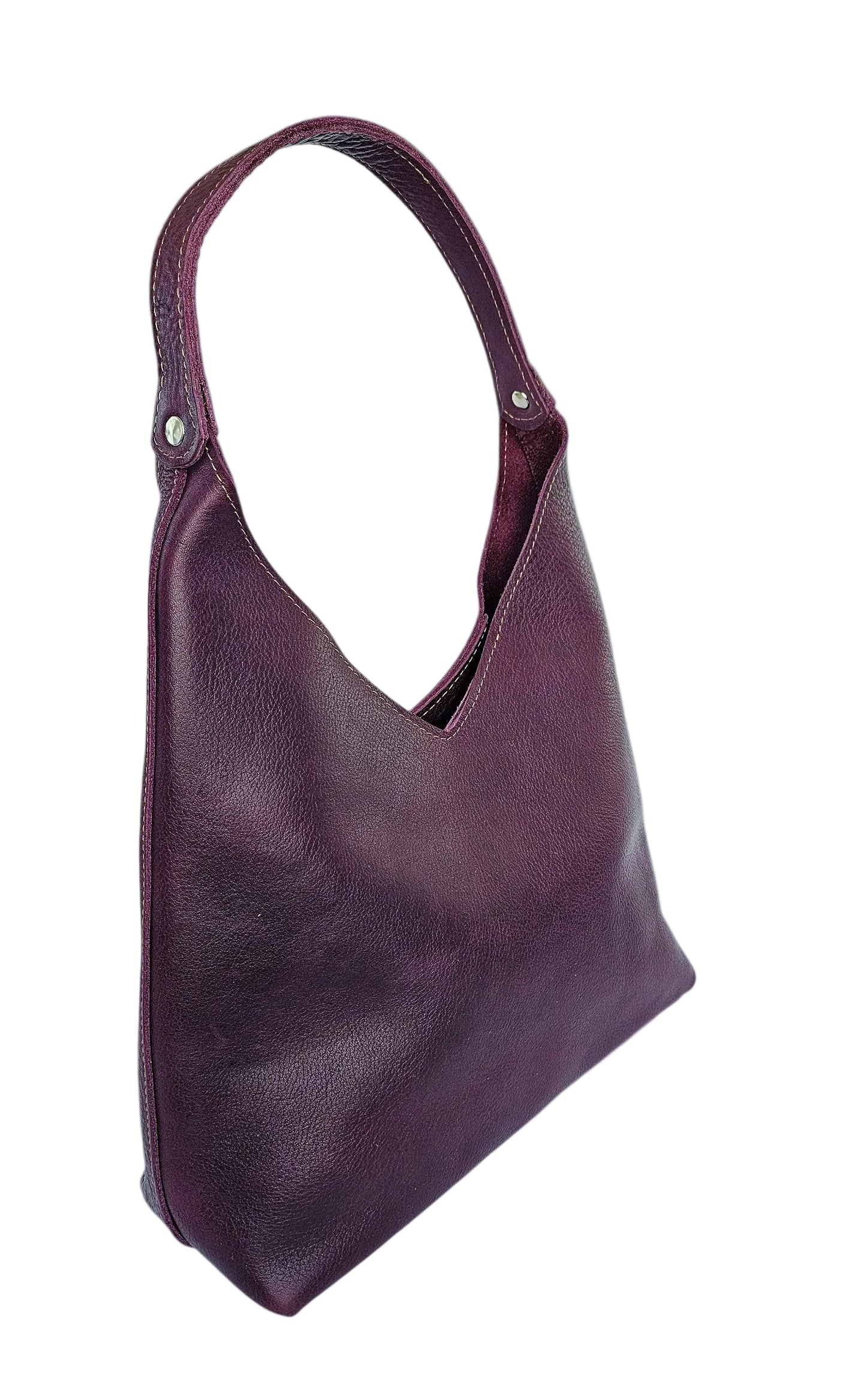Purple leather handbag on a white background