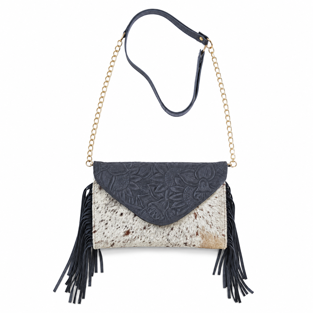 A crossbody clutch bag with a dark gray embossed leather flap, a cowhide-textured body in beige and brown, black fringe tassels, a black leather strap, and gold-tone chain details, shown on a plain white background.