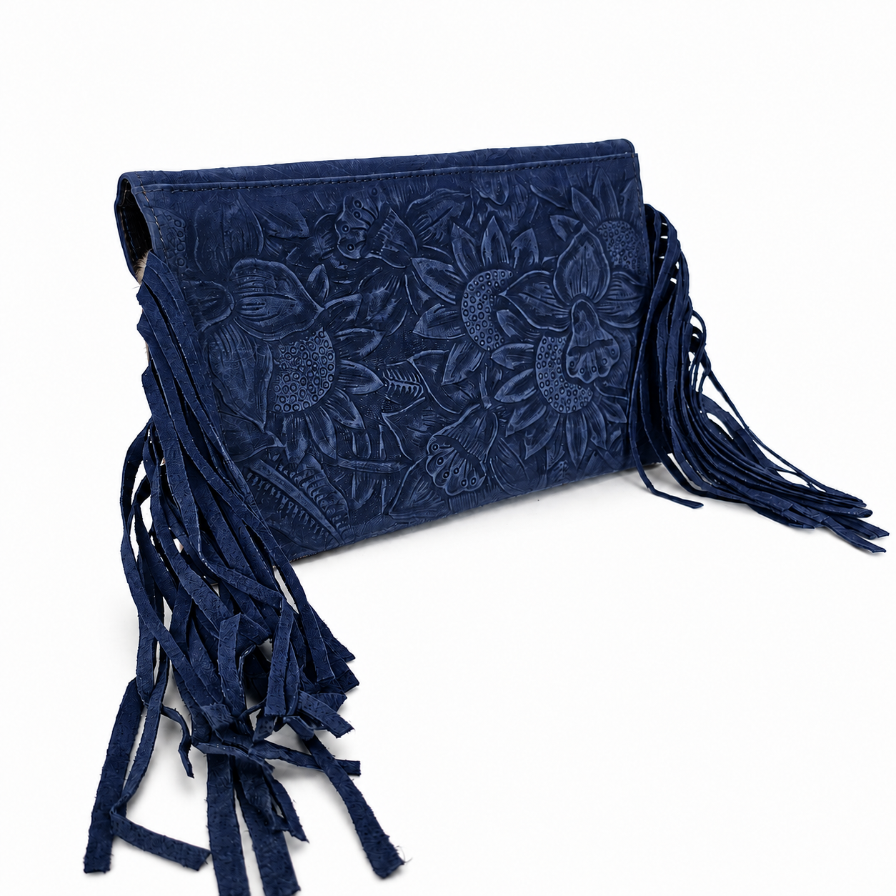A navy blue suede clutch bag featuring intricate floral tooling and long fringe tassels, shown on a plain white background.