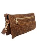 Brown leather handbag with intricate patterns and a gold zipper on a white background
